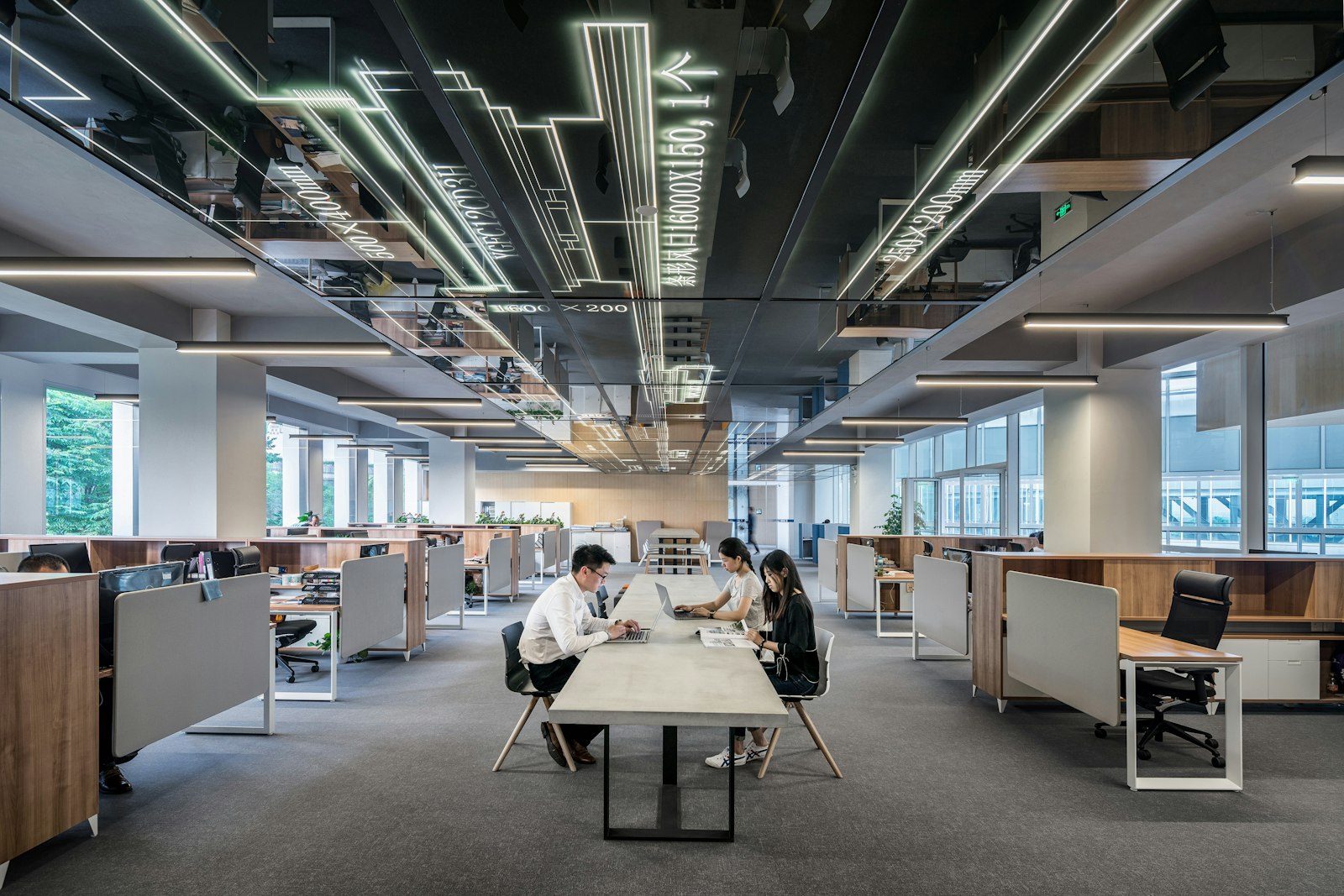 Bright modern office with teams at work