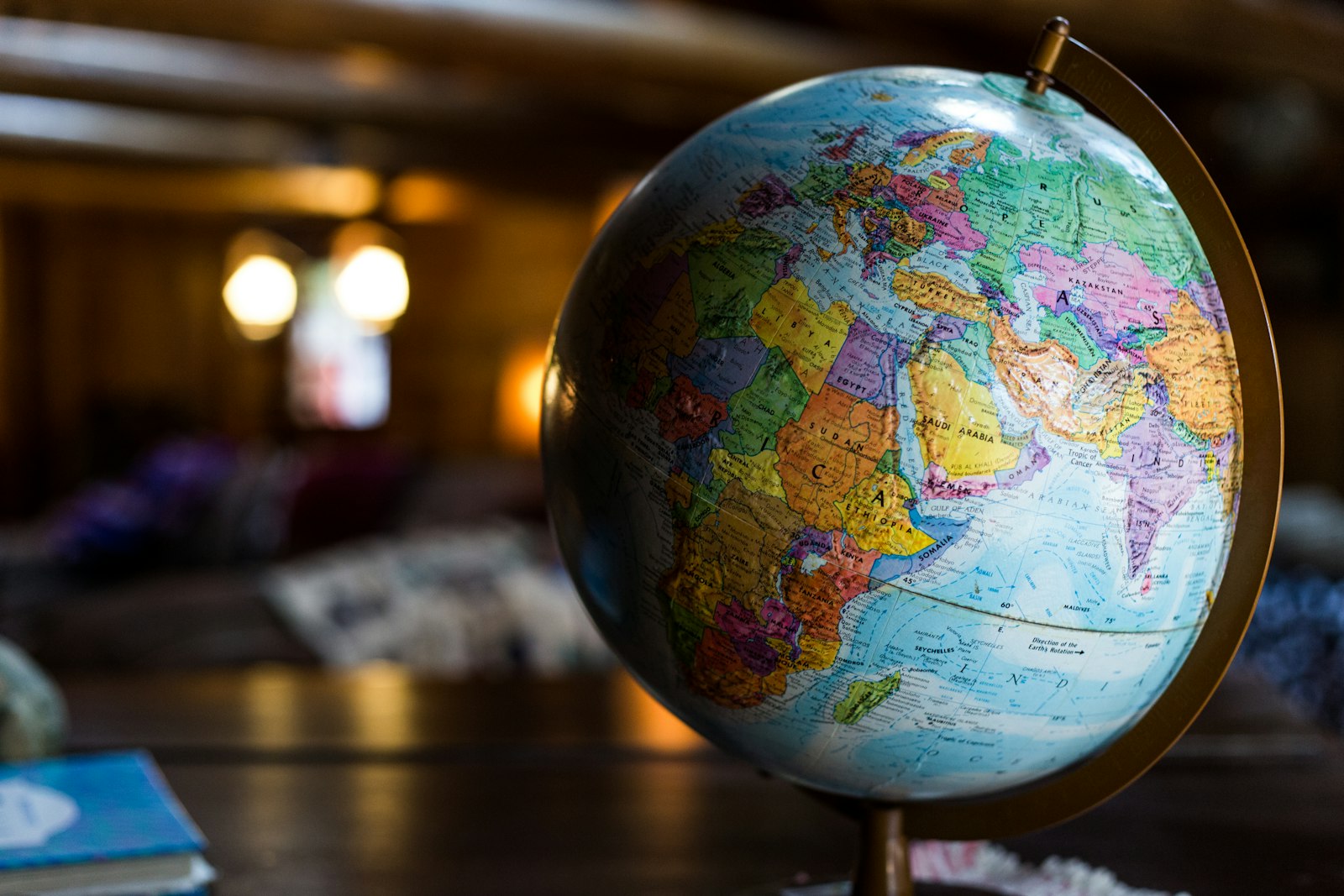 Desk globe in warm lamplight