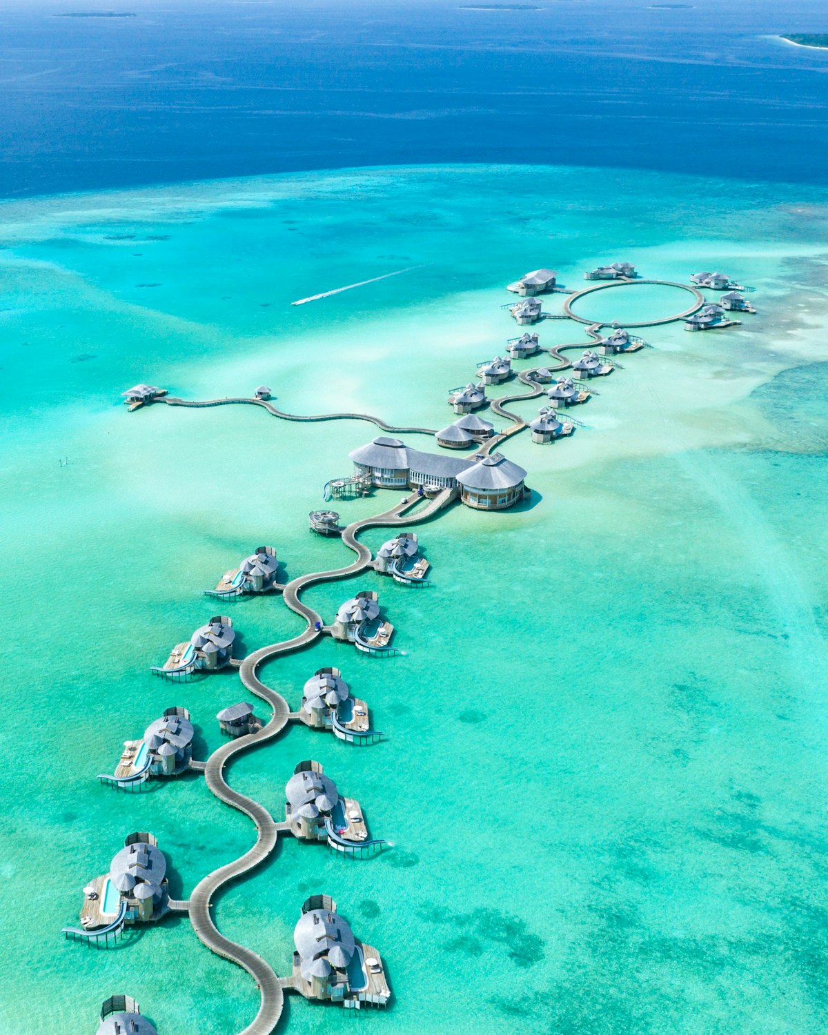 Maldives water villas over a turquoise lagoon