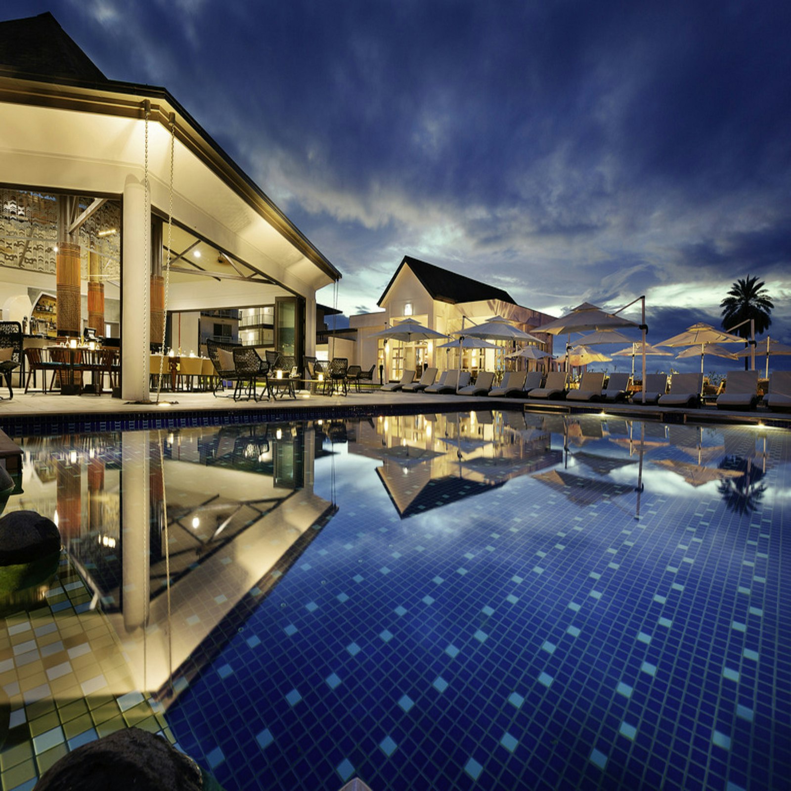 Resort pool glowing at dusk